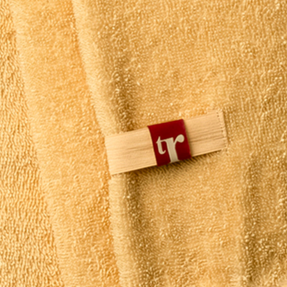 Organic hair towel in yellow with TR brand initials